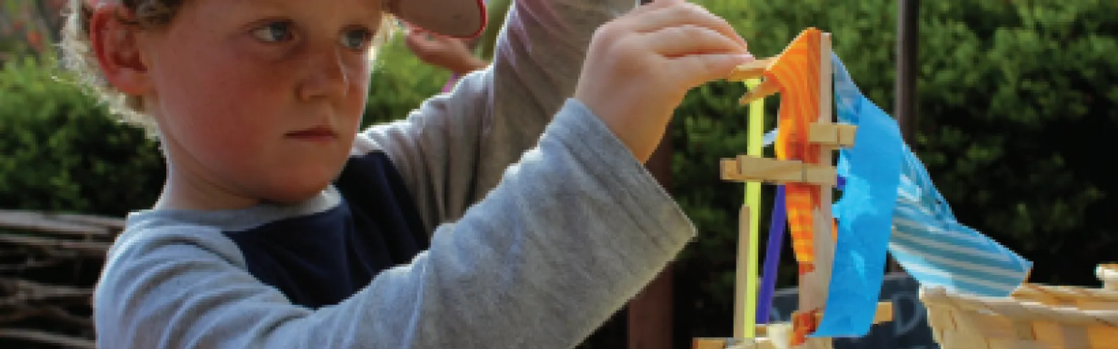 Photo of child building a structure